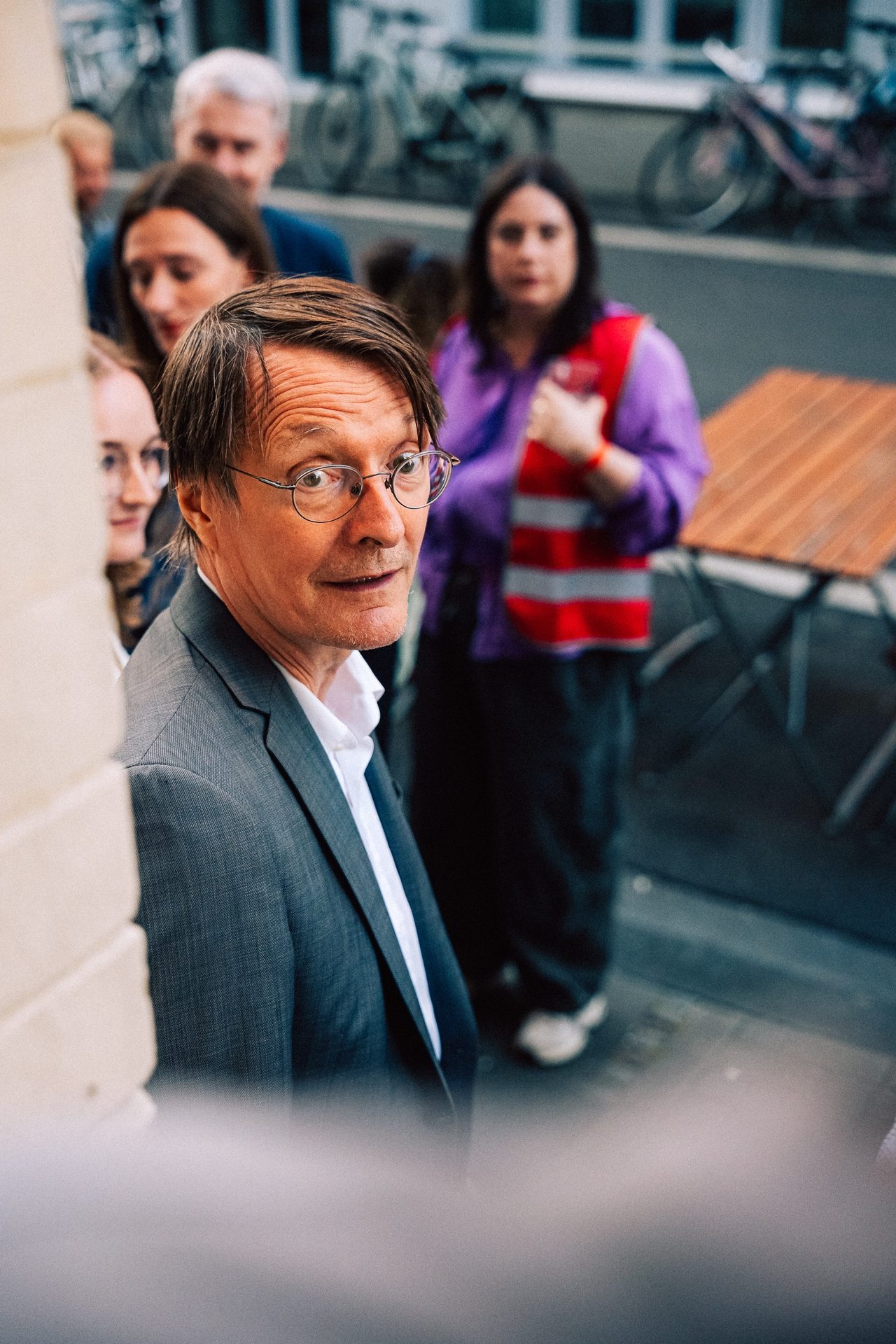 Karl Lauterbach looking to the side at a political event