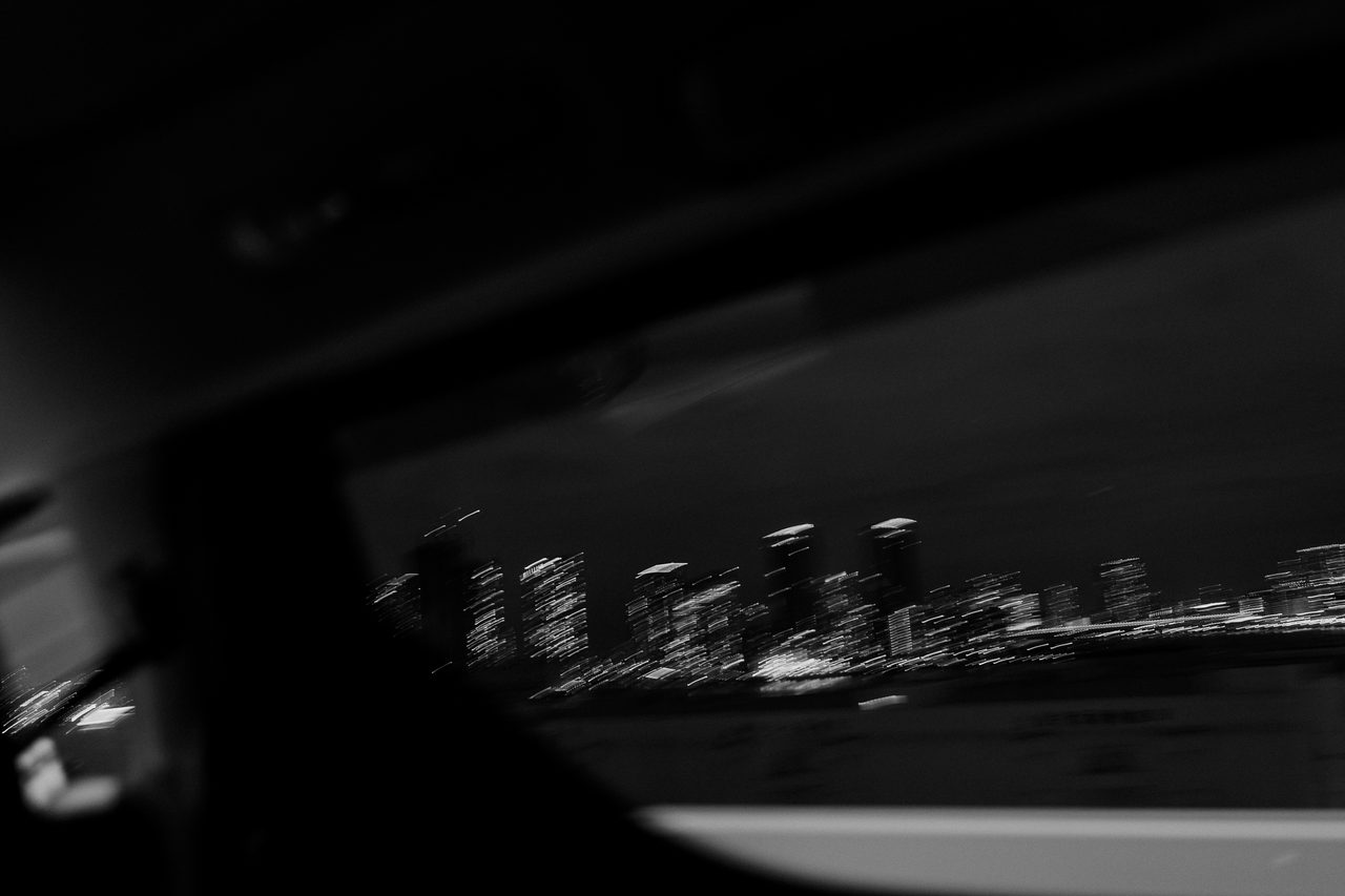 Blurred skyline during a nighttime car ride